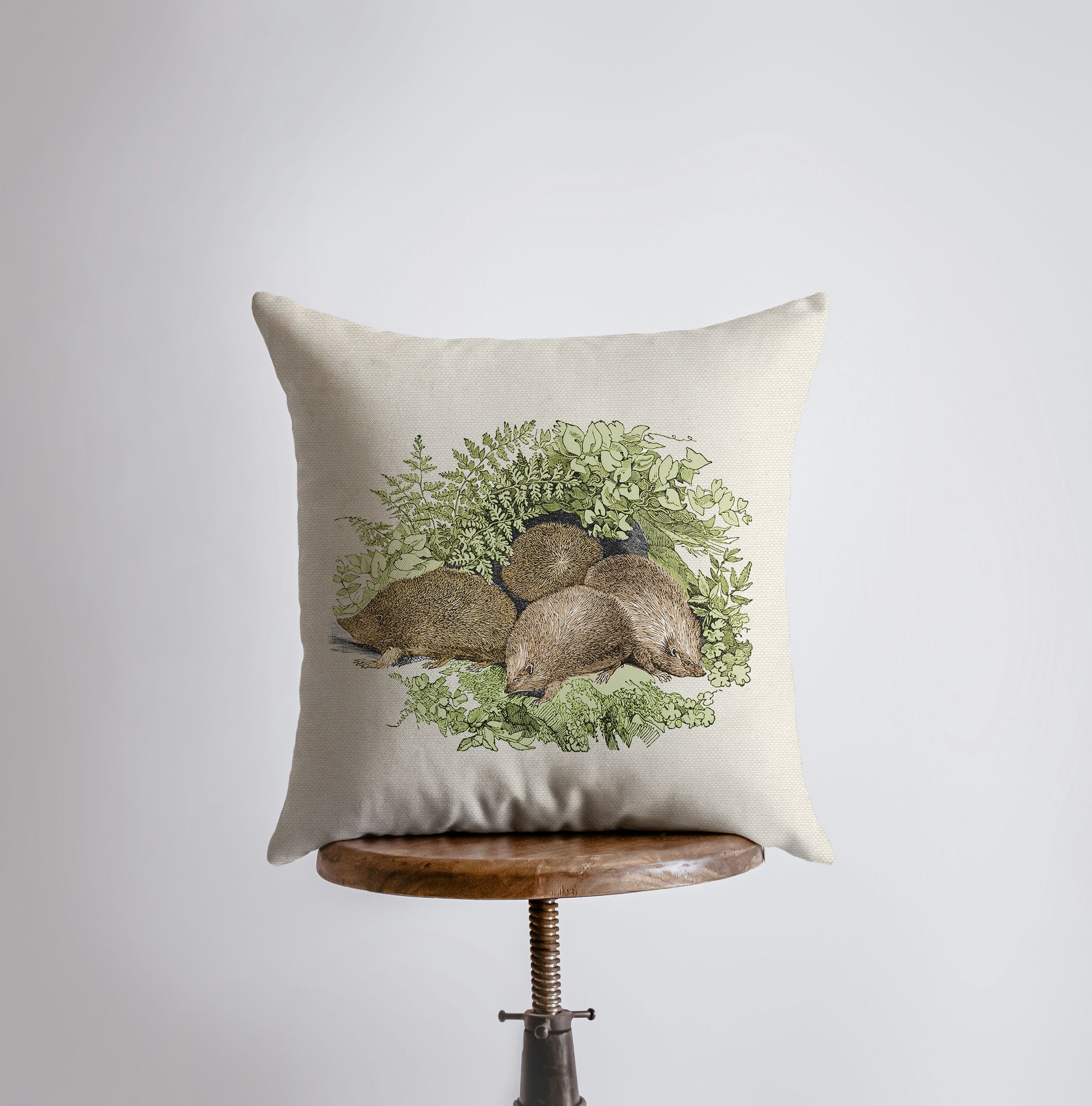 Handmade hedgehog pillow cover featuring a vintage hedgehog family design, beige back, and concealed zipper.