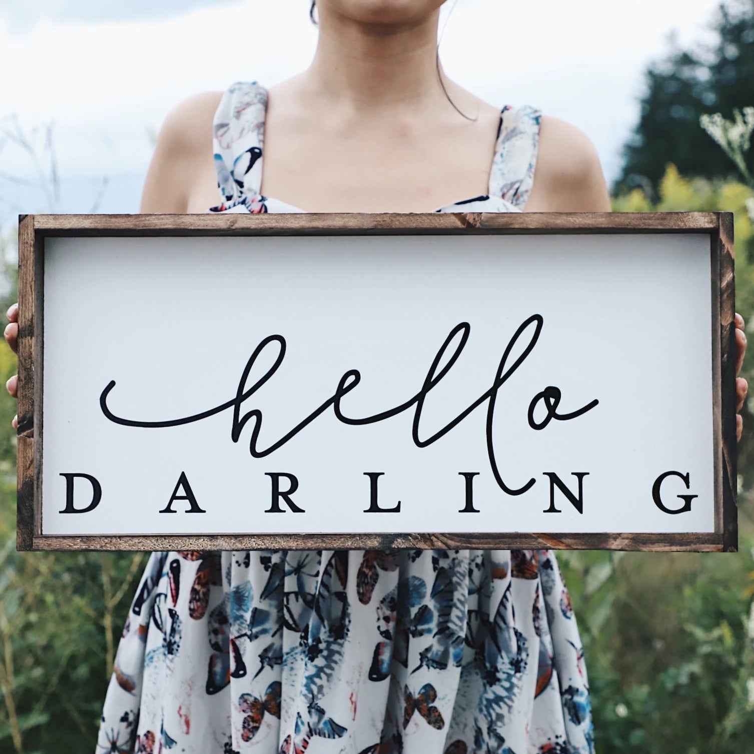 Hello Darling Wood Sign featuring elegant script on a white background, framed in stained pine wood, perfect for home decor.