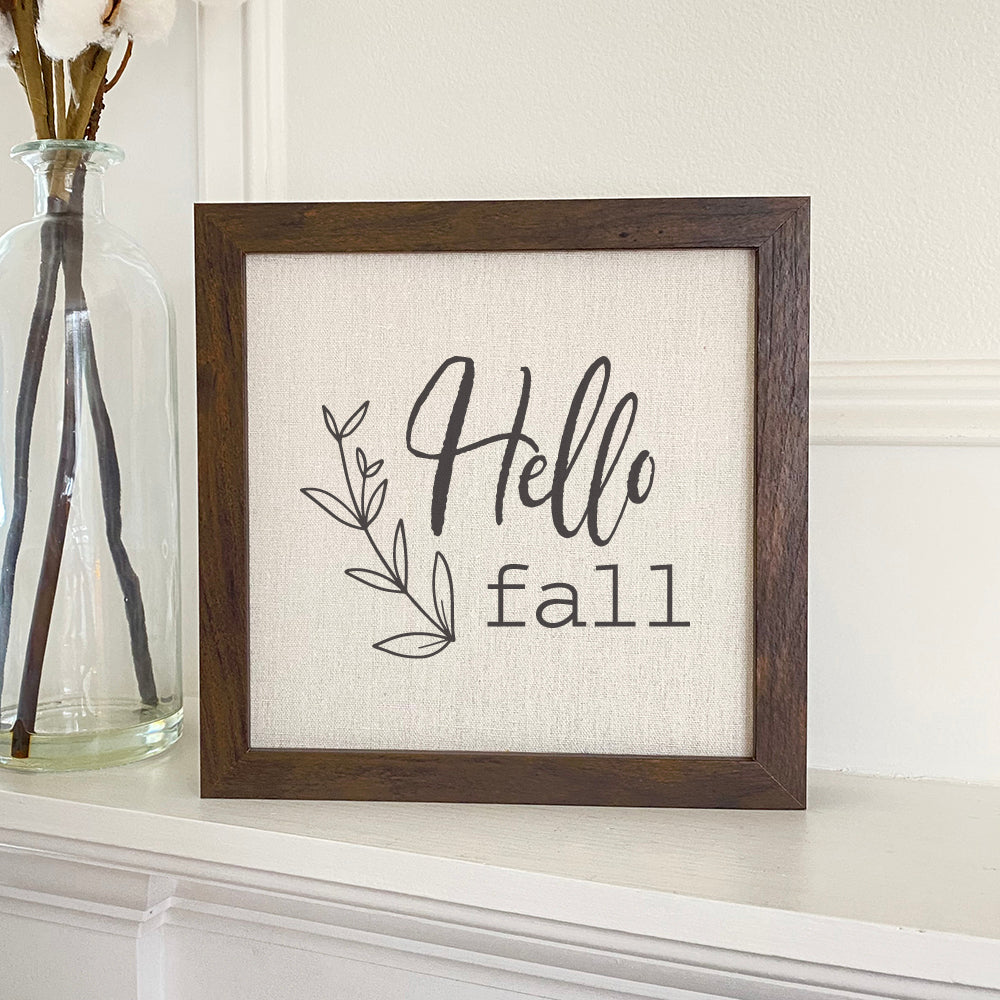 Hello Fall framed sign with a stylized wood frame and linen-look background, perfect for autumn decor.