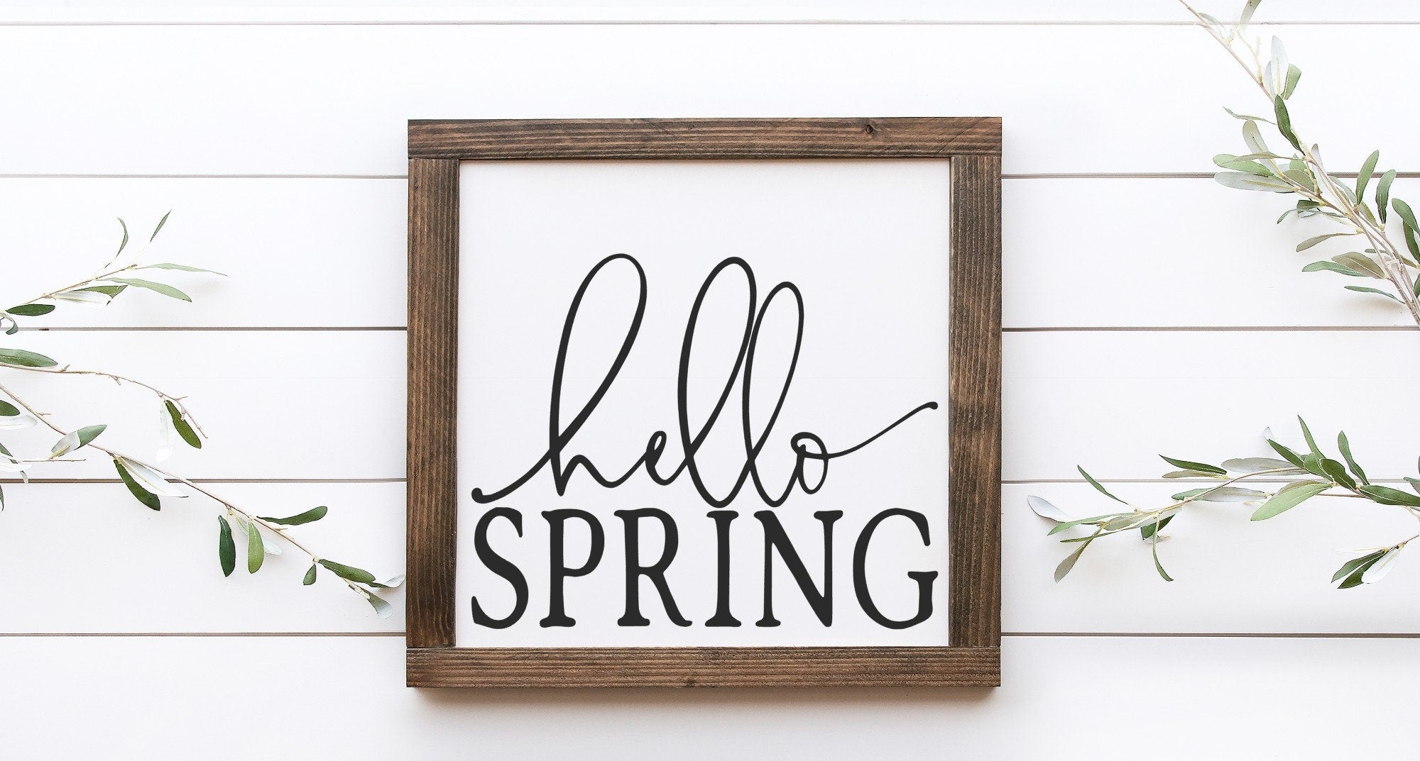 Hello Spring Wood Sign, handcrafted from 100% wood with a matte white background and vibrant lettering, perfect for spring decor.