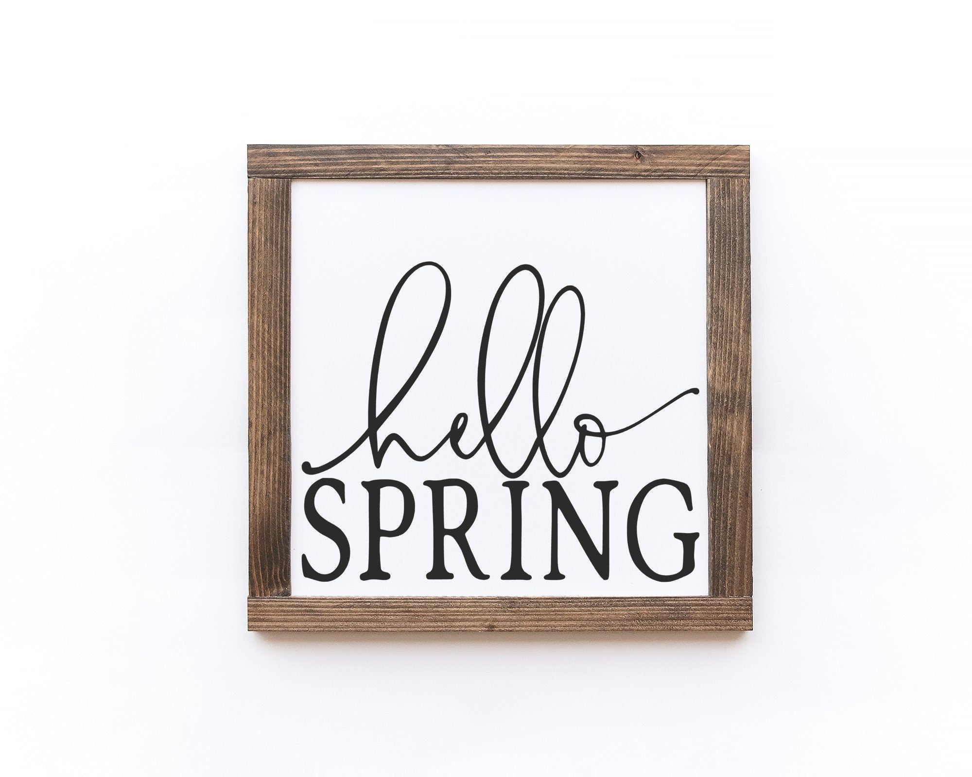 Hello Spring Wood Sign, handcrafted from 100% wood with a matte white background and vibrant lettering, perfect for spring decor.