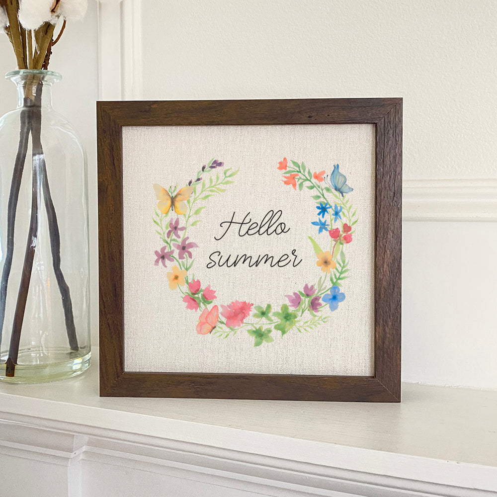 Hello Summer Wreath framed sign with a wood frame, featuring a linen-look background and eco-friendly printing.