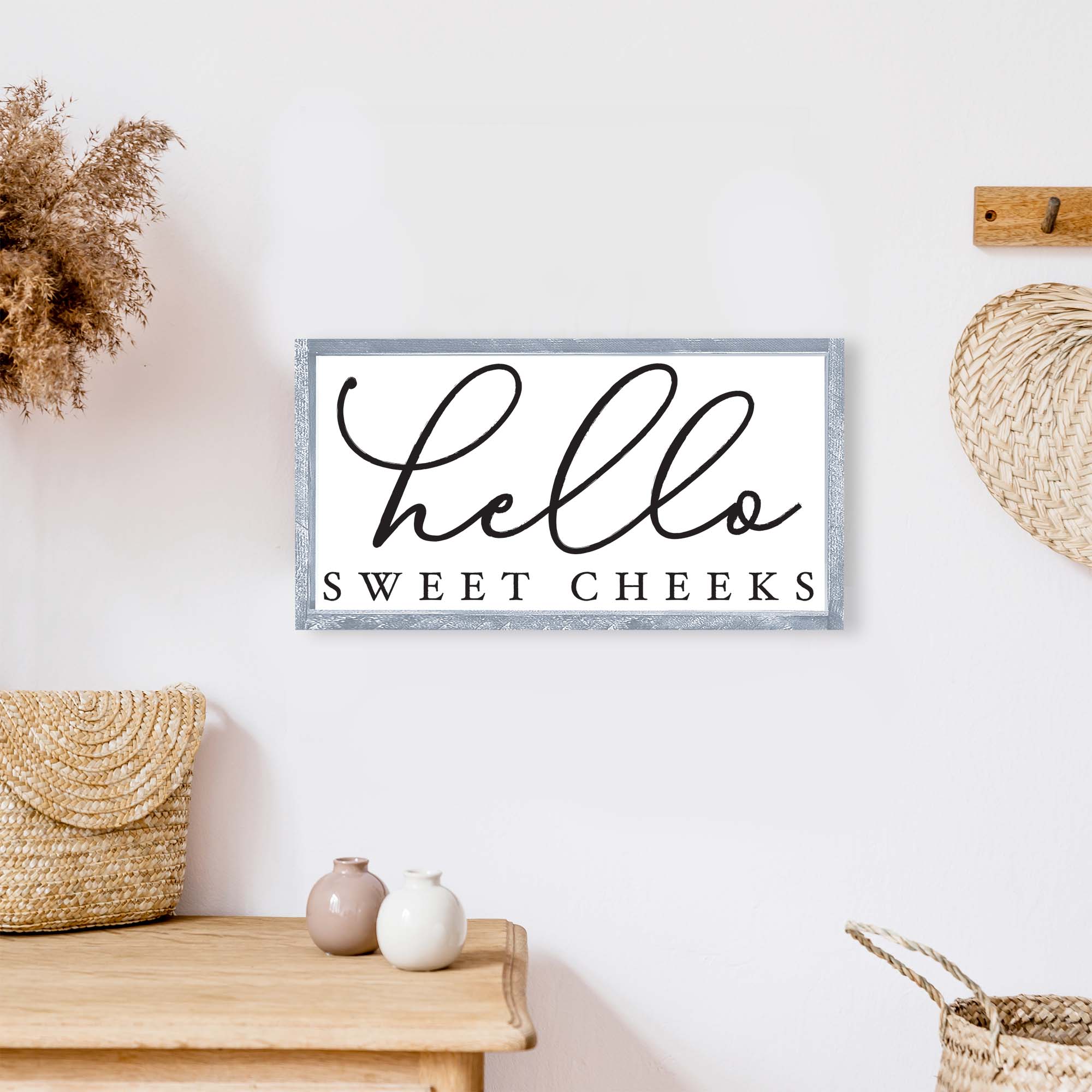 Hello Sweet Cheeks Wood Sign featuring a black text on a white background, framed in wood stain on pine, perfect for bathroom decor.