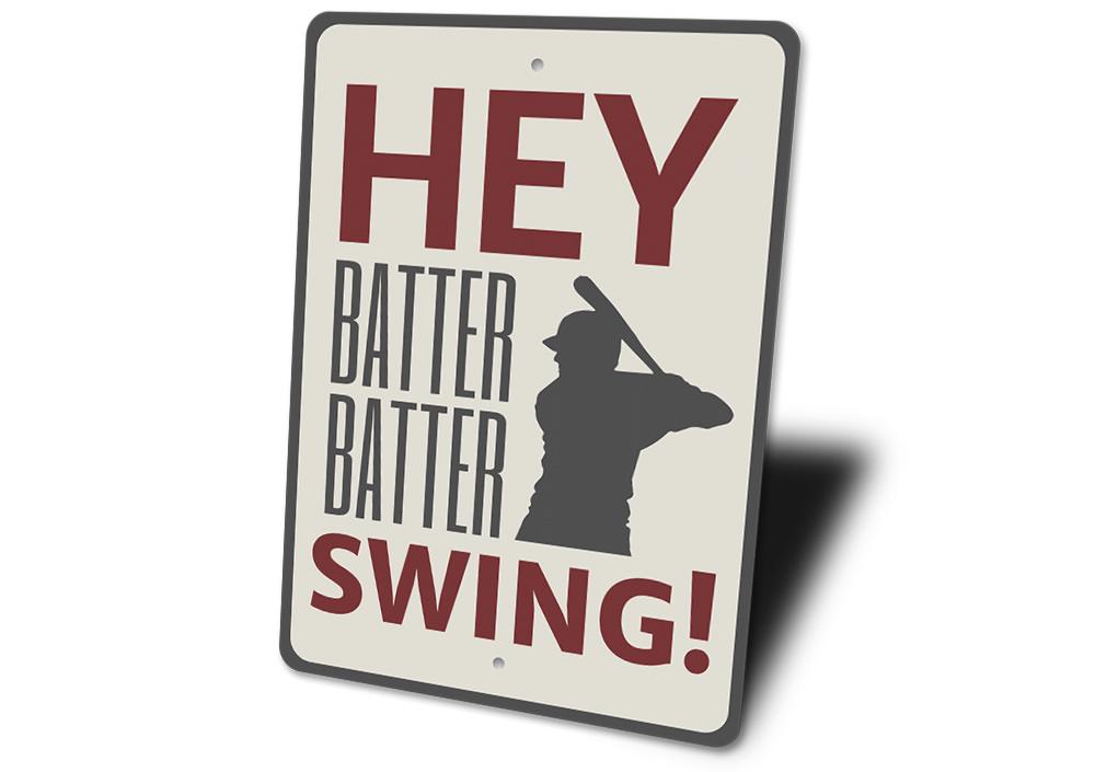 Hey Batter Batter Sign made of quality aluminum, featuring a playful design perfect for home decor.