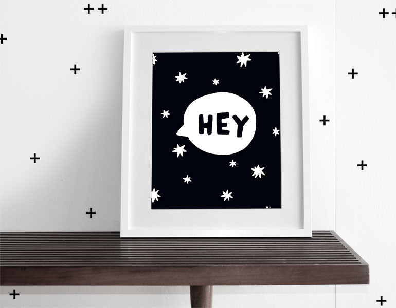 Modern wall art featuring the phrase 'Hey' surrounded by stars, designed for nursery decor.