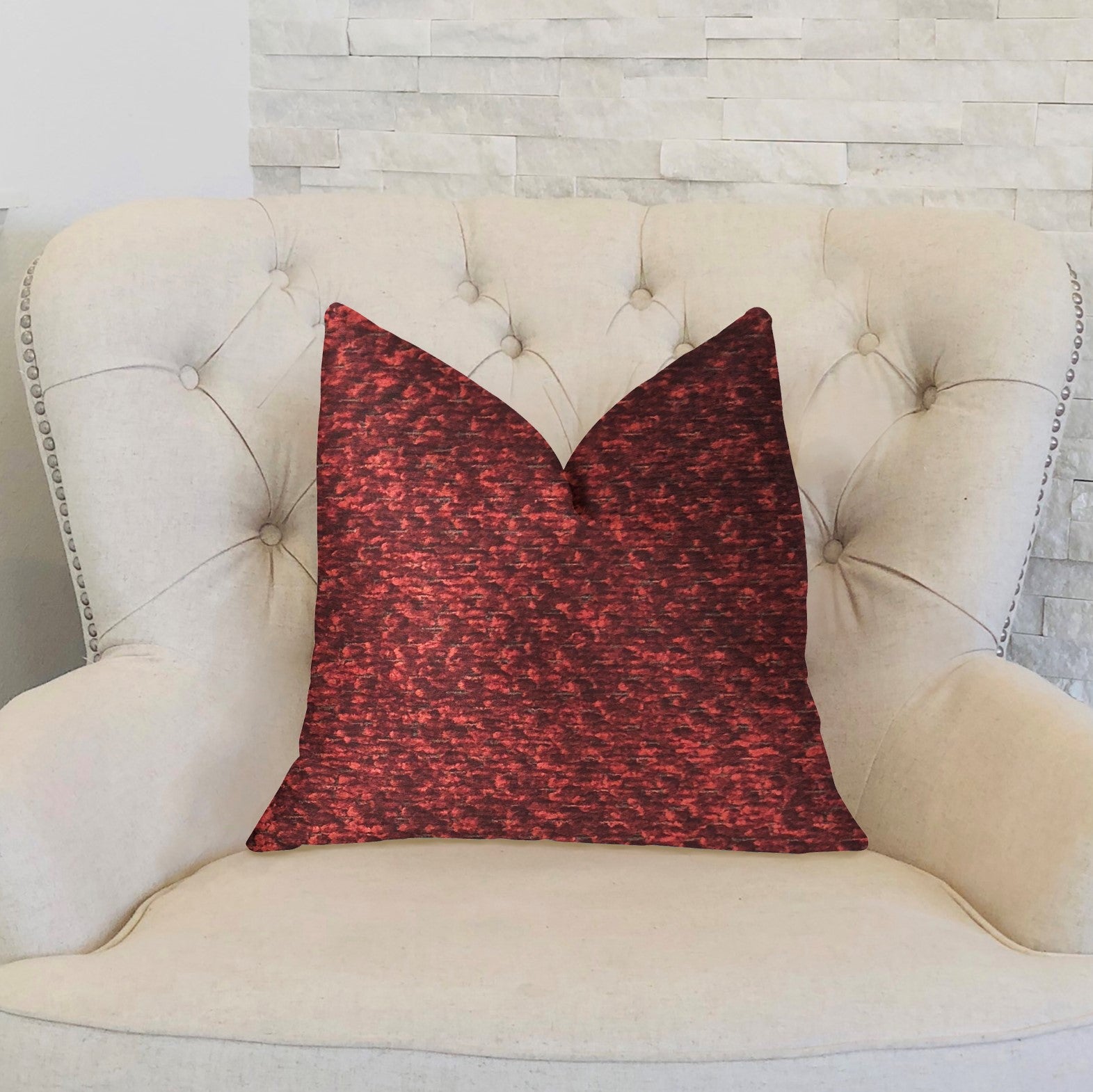 A luxurious hibiscus burgundy red throw pillow with a textured fabric, featuring an invisible zipper and double-sided design, handmade in the USA.