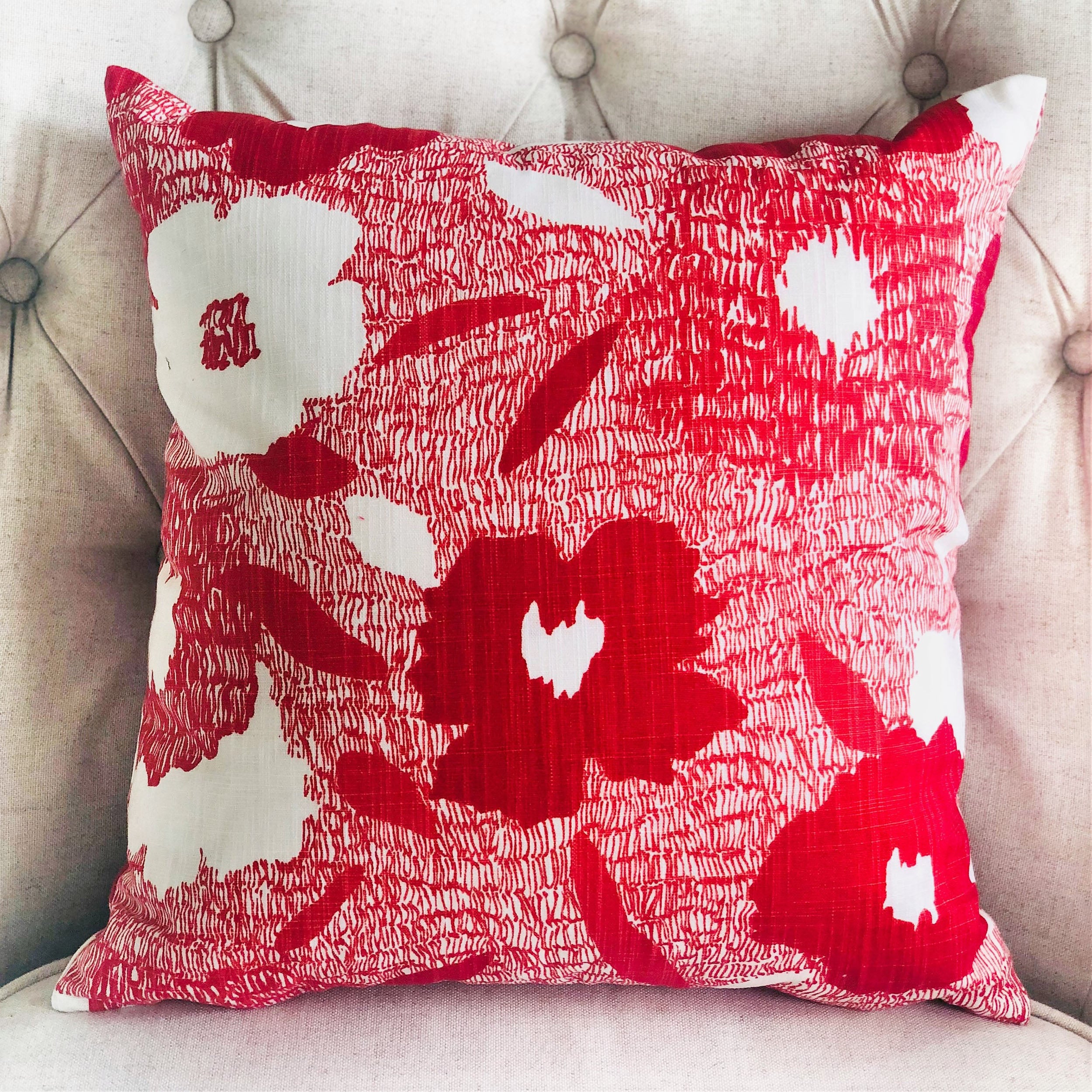 Hibiscus Red and Beige Luxury Throw Pillow featuring a floral design, handmade in the USA with a soft cotton fabric and invisible zipper.