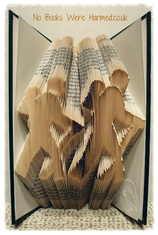 Handcrafted Hill Walkers book art made from vintage books, showcasing intricate folds and unique designs.