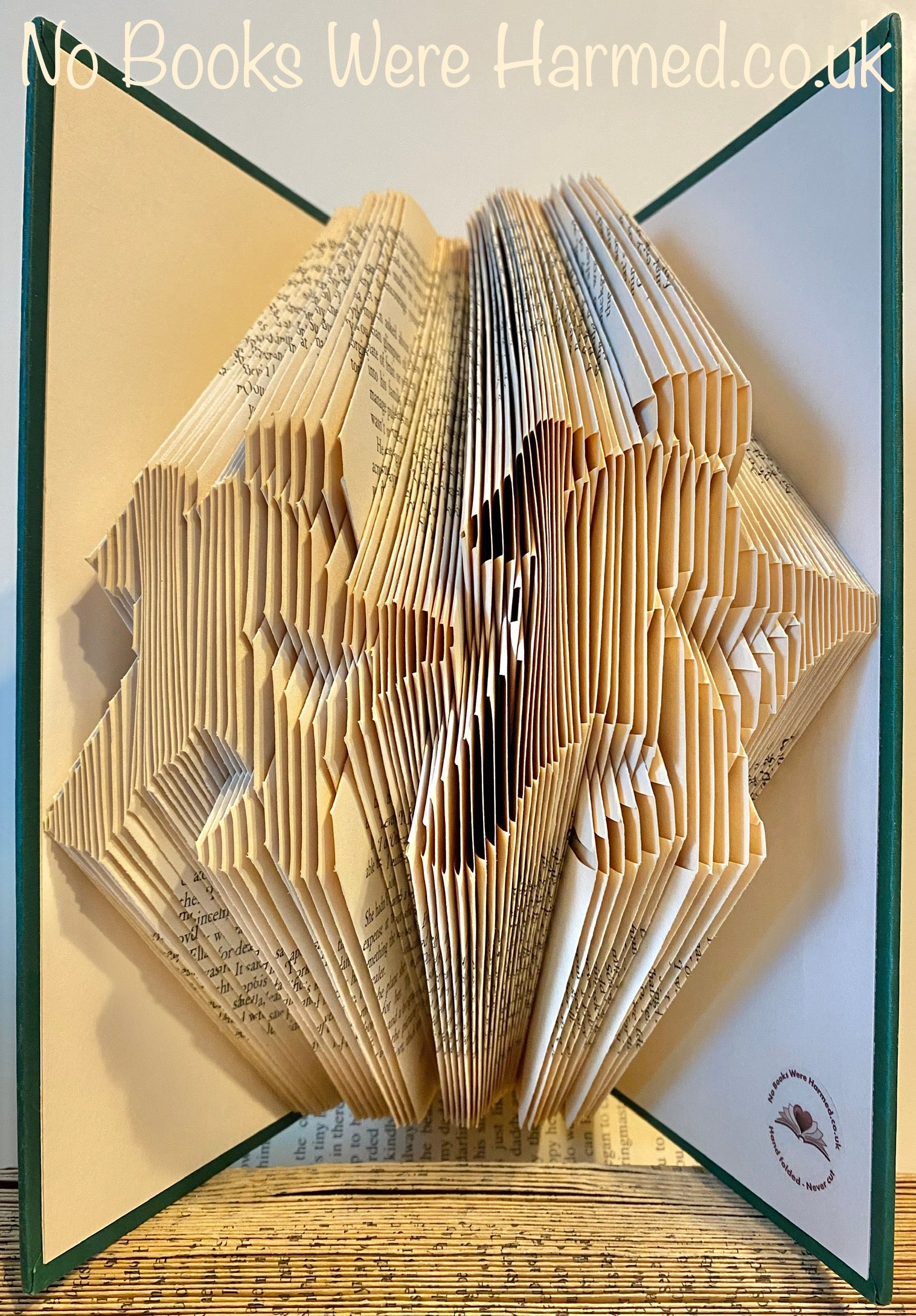 Handcrafted Hill Walkers book art made from vintage books, showcasing intricate folds and unique designs.