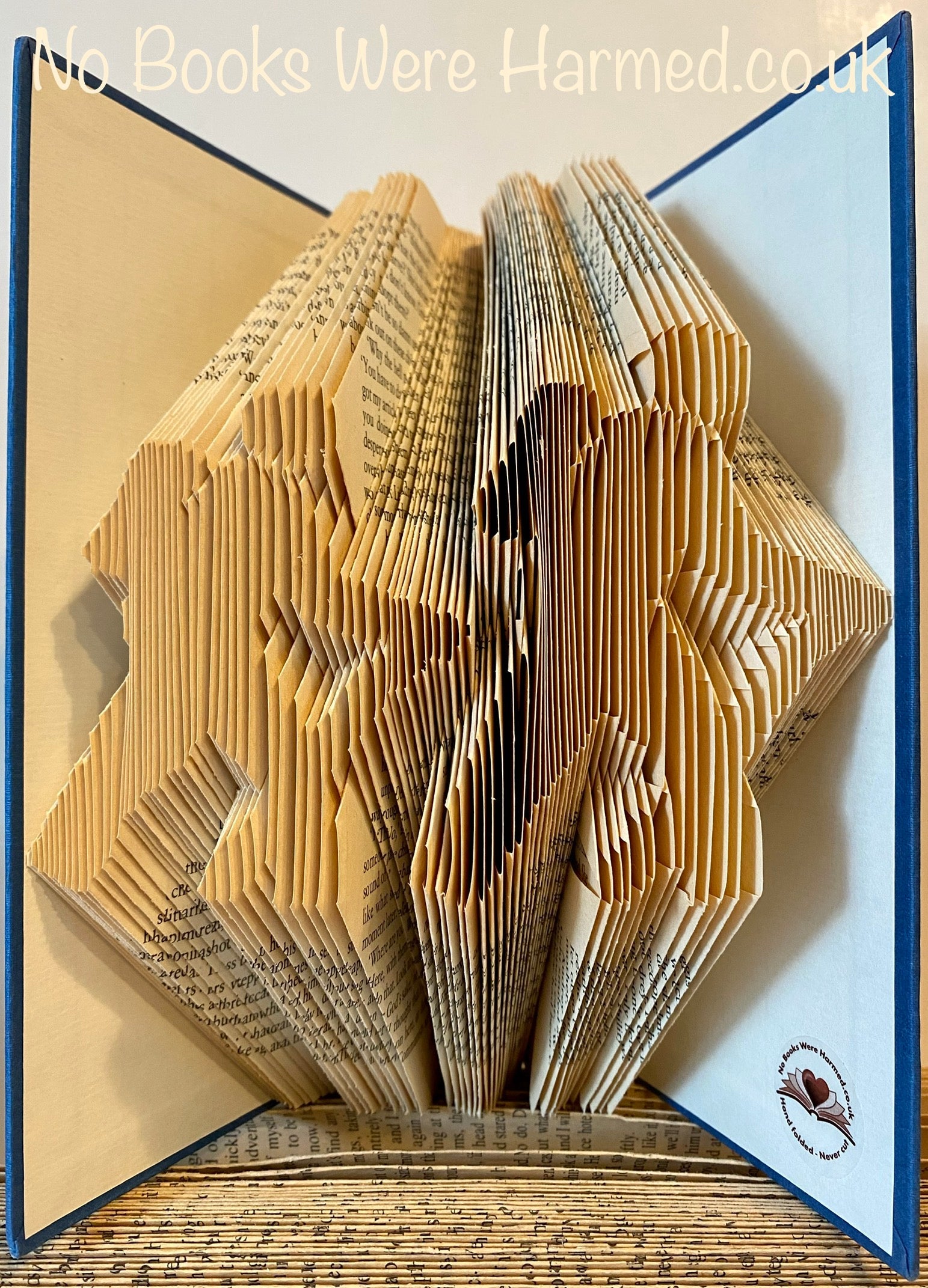 Handcrafted Hill Walkers book art made from vintage books, showcasing intricate folds and unique designs.