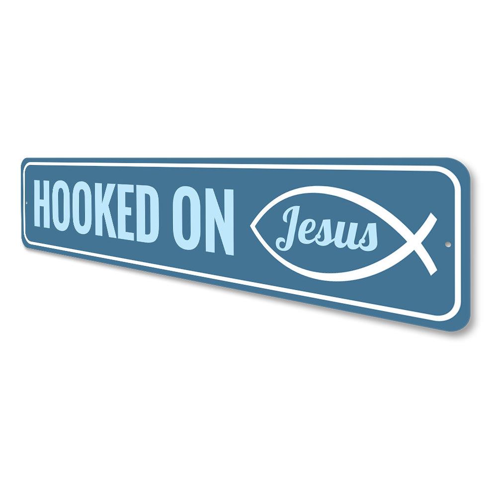 A decorative Hooked on Jesus Sign made of high-quality aluminum, featuring a beautiful design that adds a spiritual touch to any room.