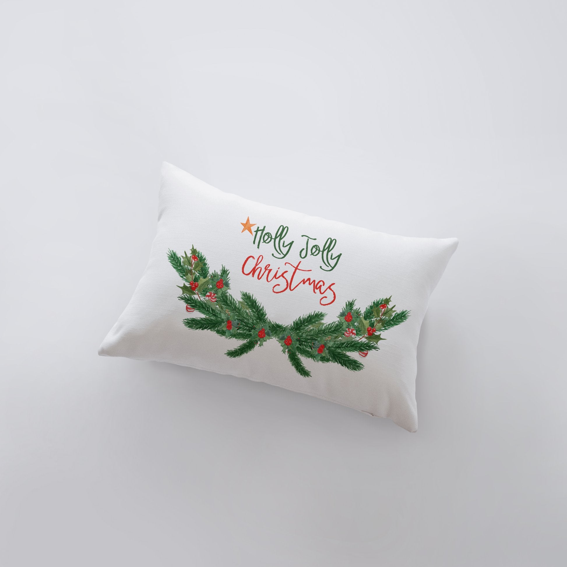 Holly Jolly Christmas Garland Pillow Cover with white background and pine tree swag design, measuring 18x12 inches.