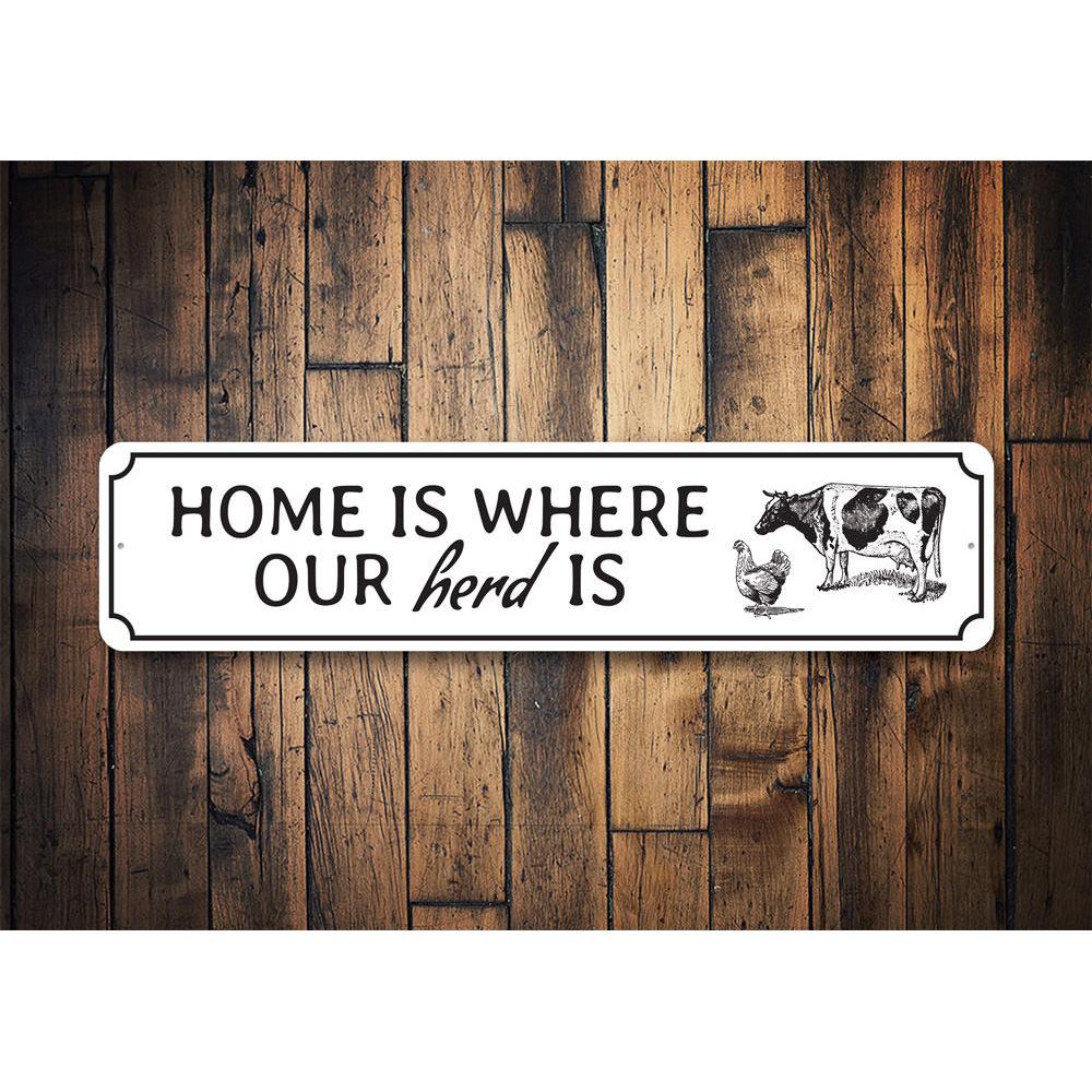 A decorative metal sign reading 'Home Is Where Our Herd Is', showcasing quality craftsmanship and customizable options.