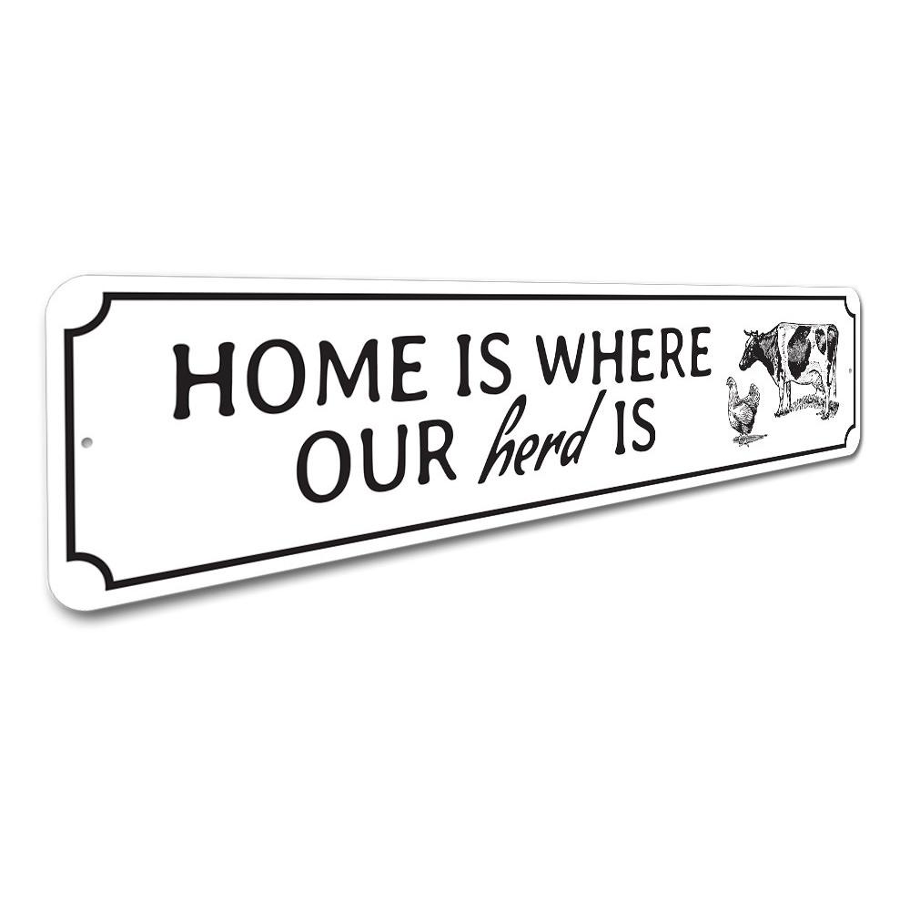 A decorative metal sign reading 'Home Is Where Our Herd Is', showcasing quality craftsmanship and customizable options.