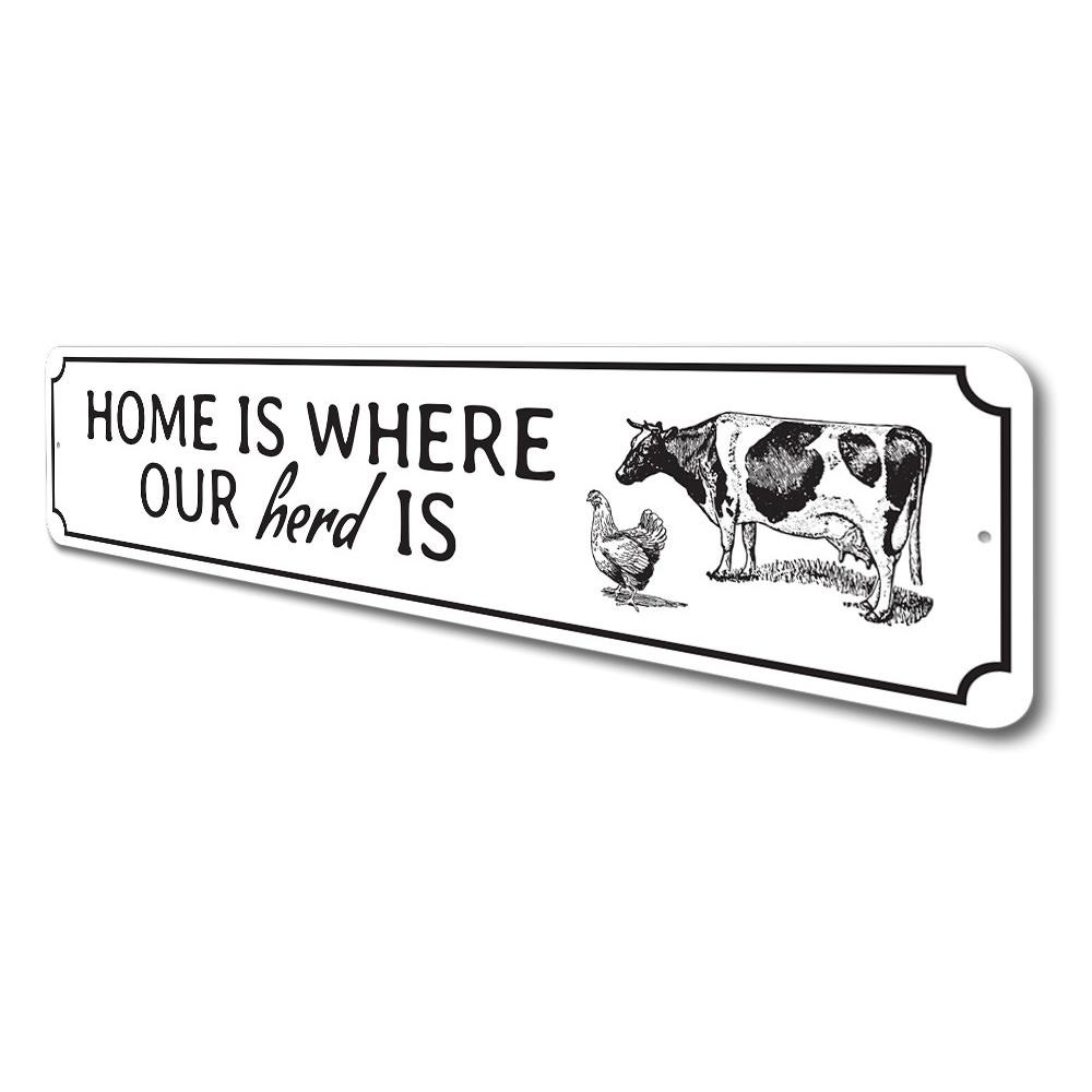 A decorative metal sign reading 'Home Is Where Our Herd Is', showcasing quality craftsmanship and customizable options.