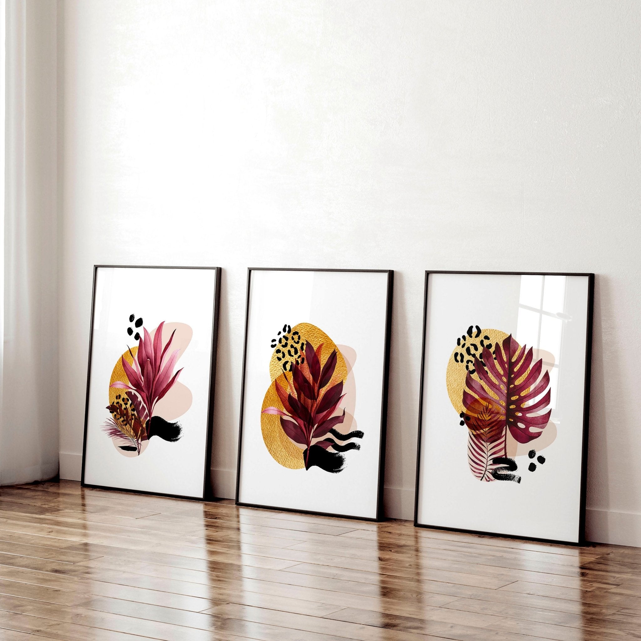 Set of 3 framed wall art prints featuring vibrant botanical designs in burgundy, black, and gold tones, perfect for home office decor.