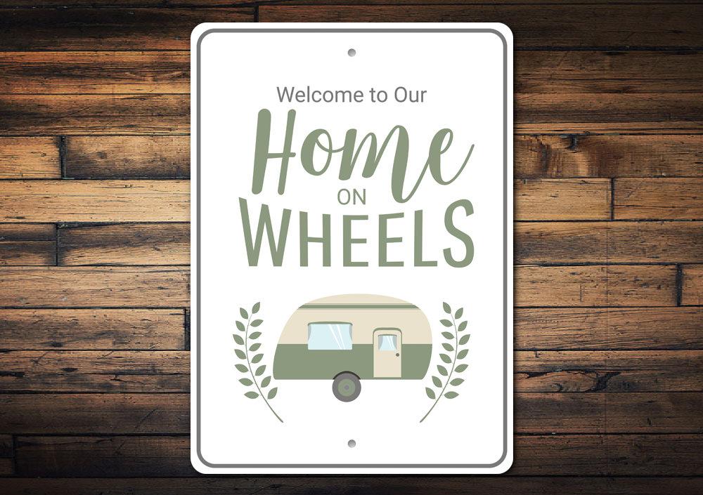 A decorative Home on Wheels Sign made of high-quality aluminum, featuring a unique design suitable for indoor and outdoor use.