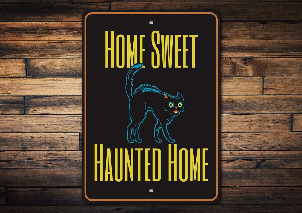 A decorative metal sign reading 'Home Sweet Haunted Home' with spooky Halloween-themed design, perfect for indoor or outdoor decoration.