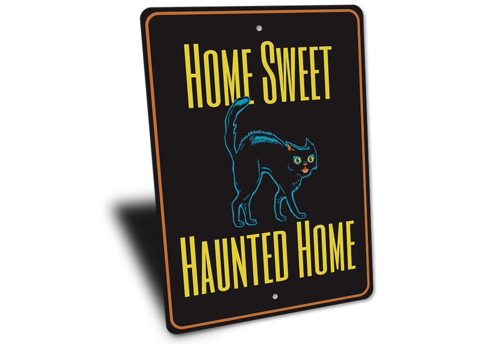 A decorative metal sign reading 'Home Sweet Haunted Home' with spooky Halloween-themed design, perfect for indoor or outdoor decoration.