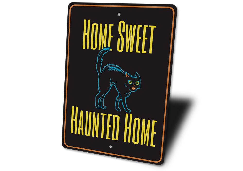 A decorative metal sign reading 'Home Sweet Haunted Home' with spooky Halloween-themed design, perfect for indoor or outdoor decoration.