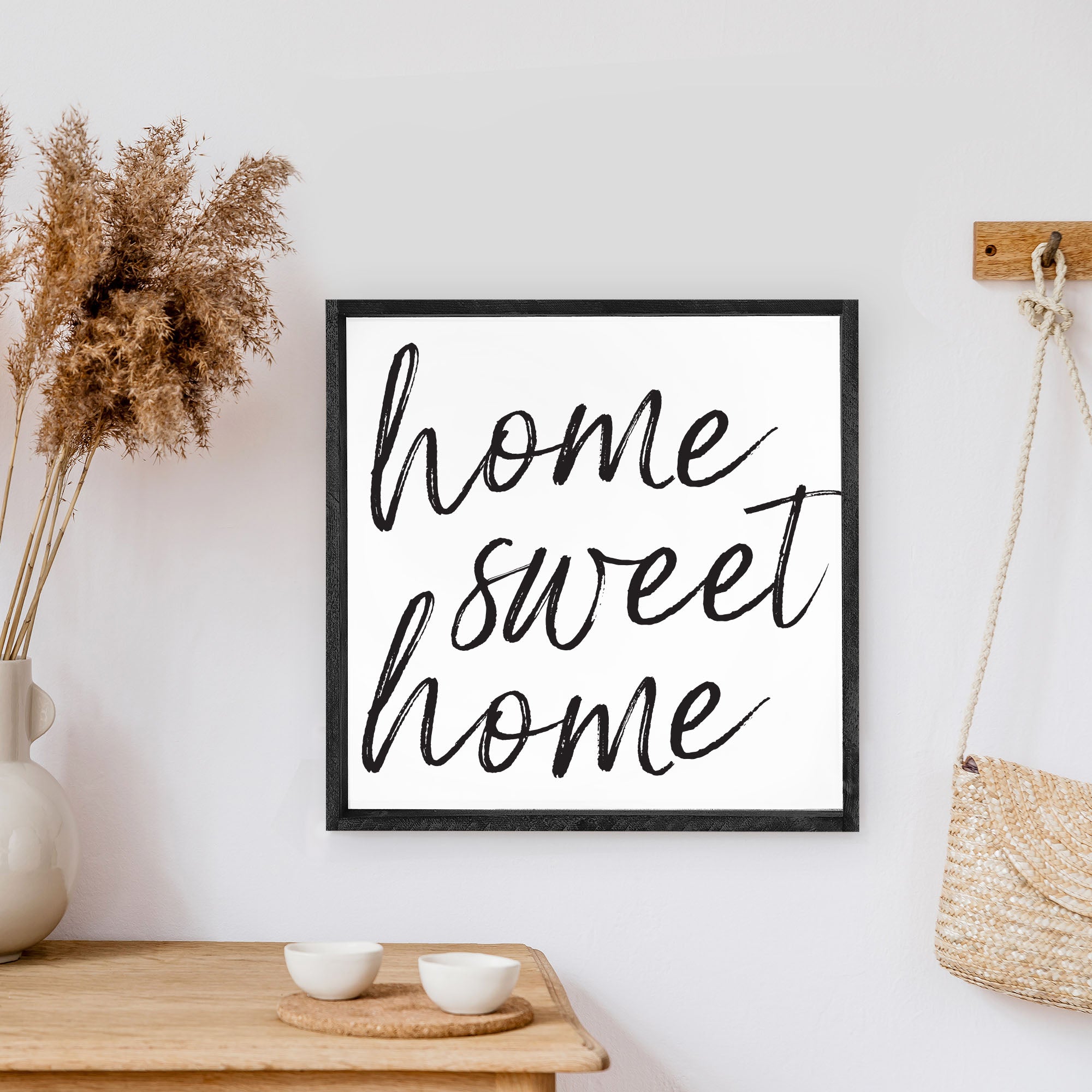 A charming Home Sweet Home Wood Sign, measuring 13x13 inches, featuring black waterproof text on a white background with a rustic wood frame.