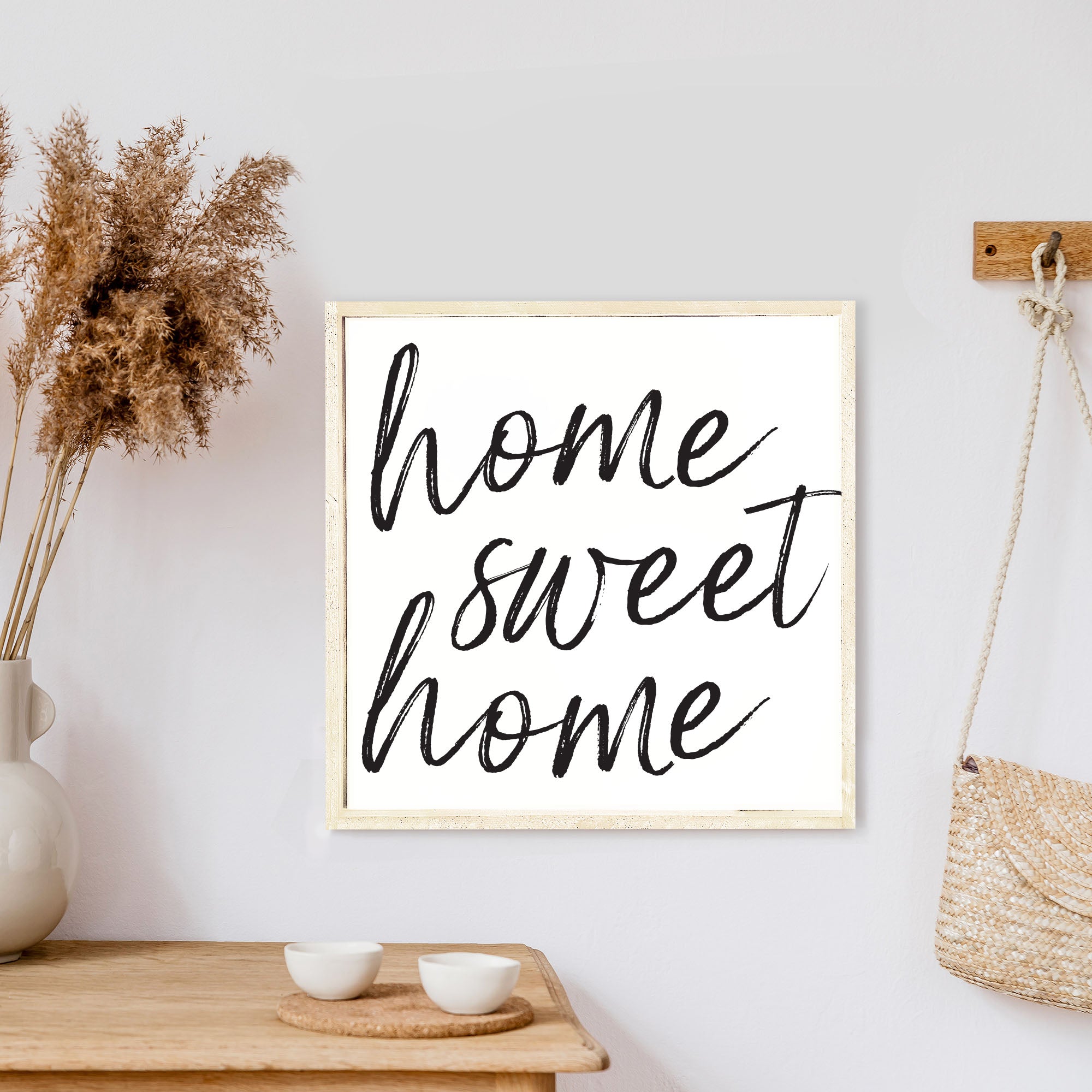 A charming Home Sweet Home Wood Sign, measuring 13x13 inches, featuring black waterproof text on a white background with a rustic wood frame.