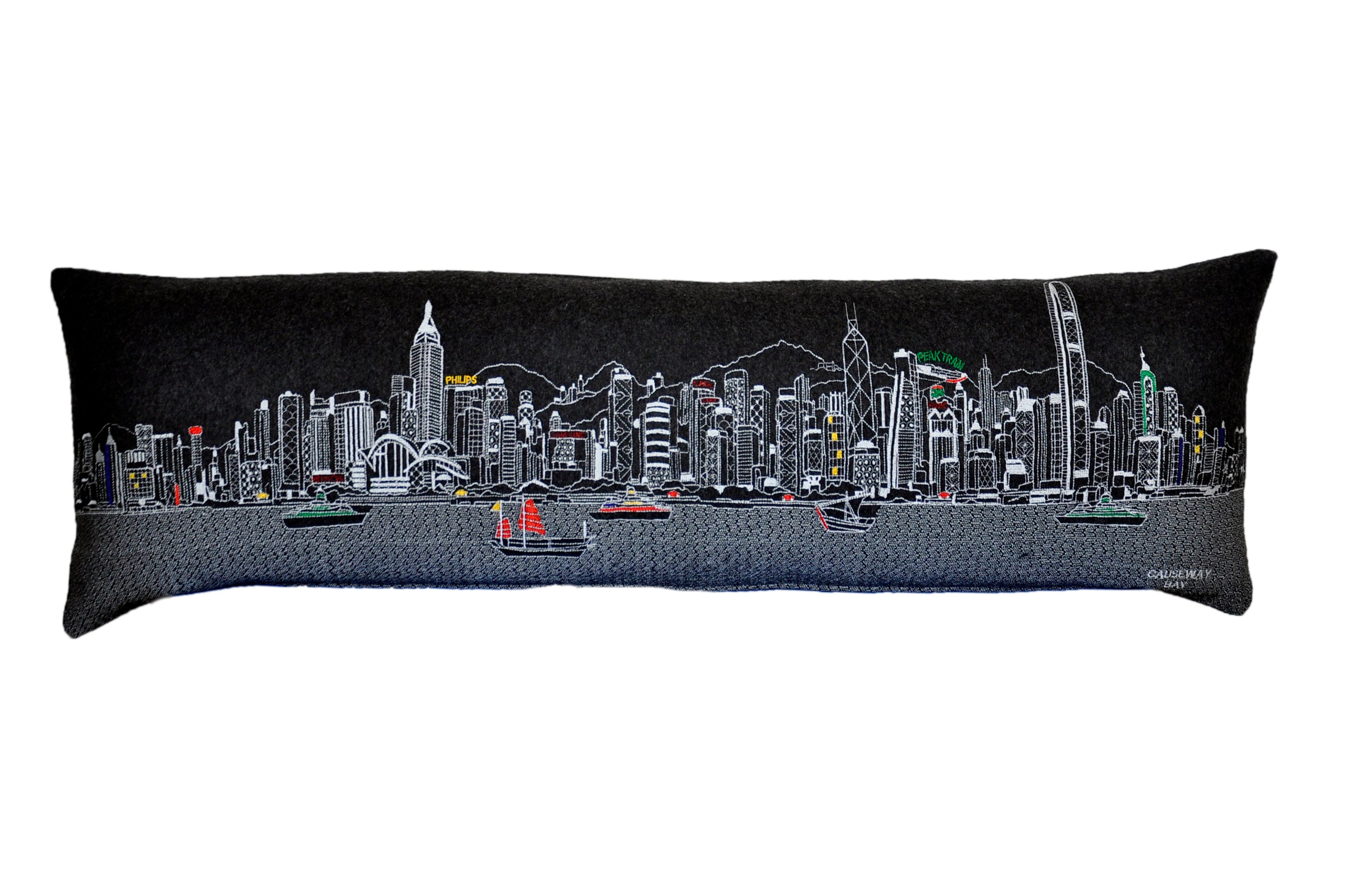 Decorative pillow featuring the iconic skyline of Hong Kong with vibrant colors and details.