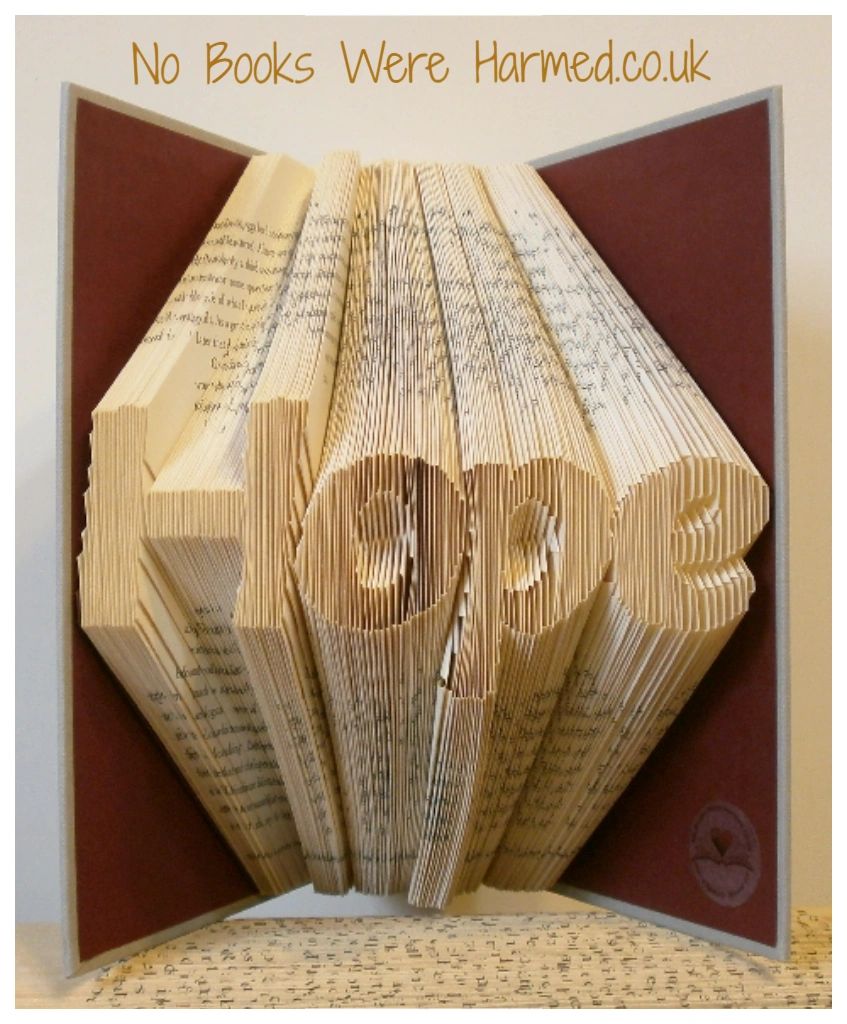 Hand folded book art titled 'Hope', showcasing intricate page folds from vintage books, perfect for home decor.