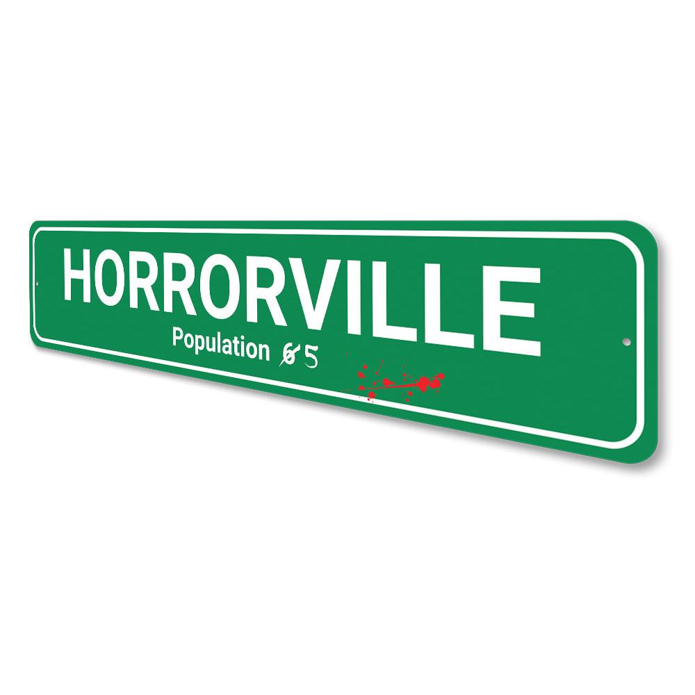 Green "Horrorville" sign with bloodstains.