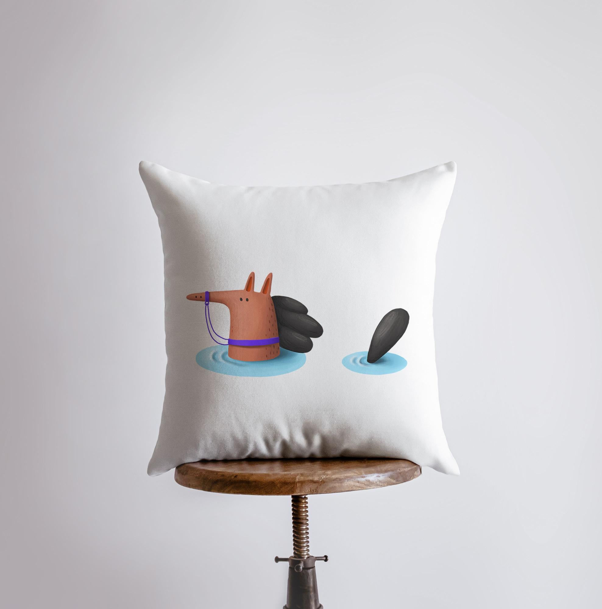 A charming Horse Swimming Pillow featuring playful horses in a swimming scene, with a stark white back and concealed zipper closure.