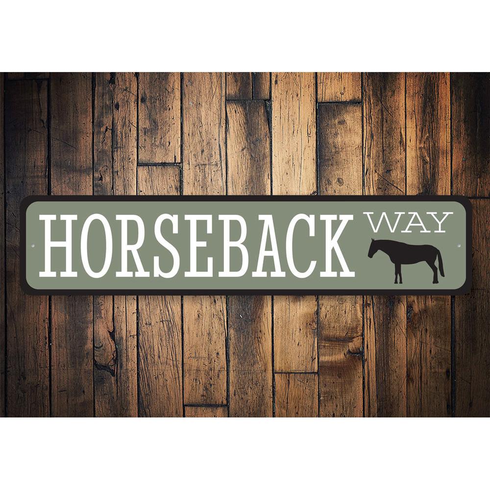 A decorative Horseback Way Sign made of durable aluminum, showcasing a rustic design perfect for lakehouses.