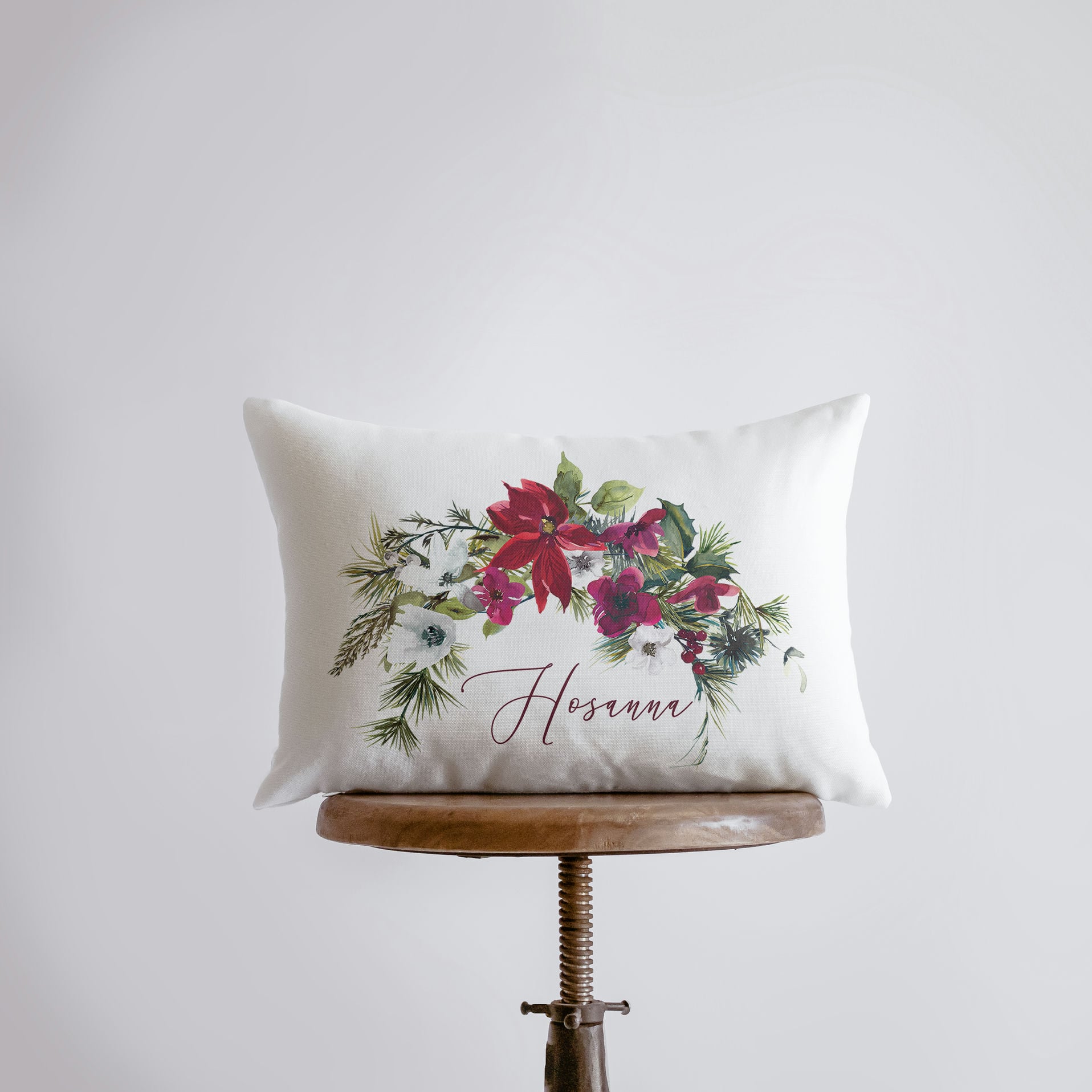 Hosanna Christmas Poinsettia Throw Pillow Cover featuring vibrant poinsettia design and cursive text on a white background.