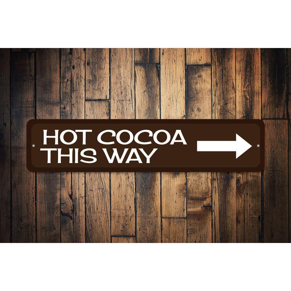 A festive Hot Cocoa Arrow Sign made of high-quality aluminum, featuring a charming design perfect for holiday decorations.