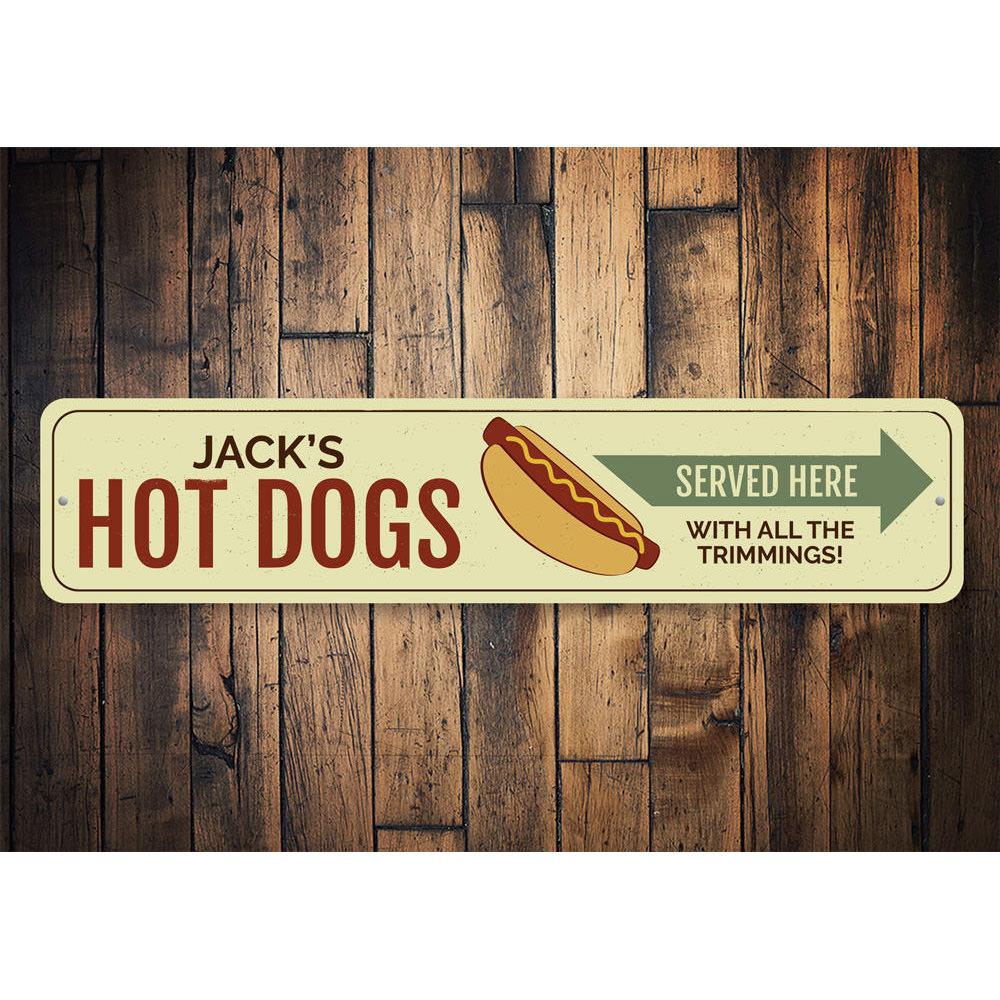 A vibrant aluminum sign reading 'Hot Dogs Served Here', perfect for restaurants and cafes, showcasing quality craftsmanship.