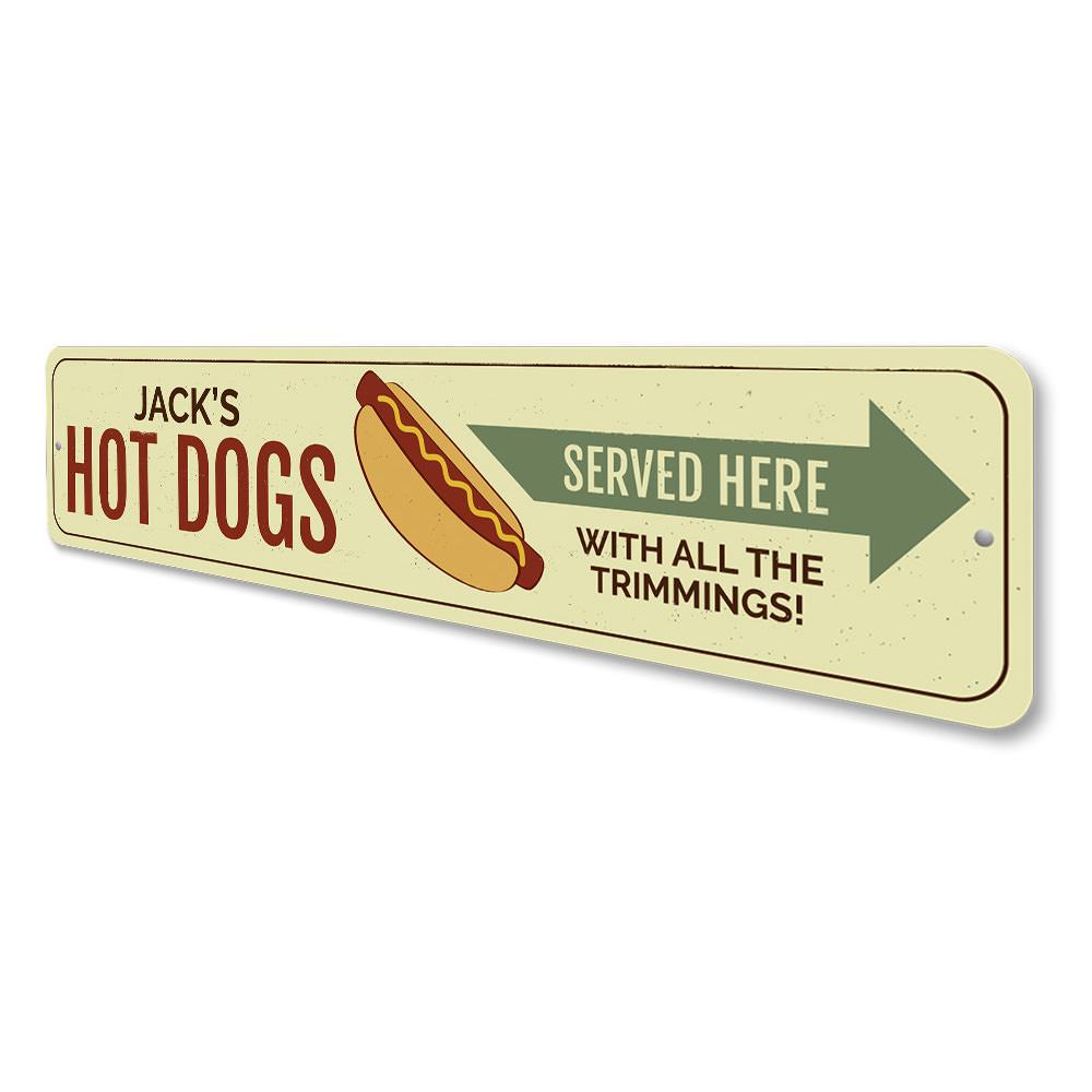 A vibrant aluminum sign reading 'Hot Dogs Served Here', perfect for restaurants and cafes, showcasing quality craftsmanship.