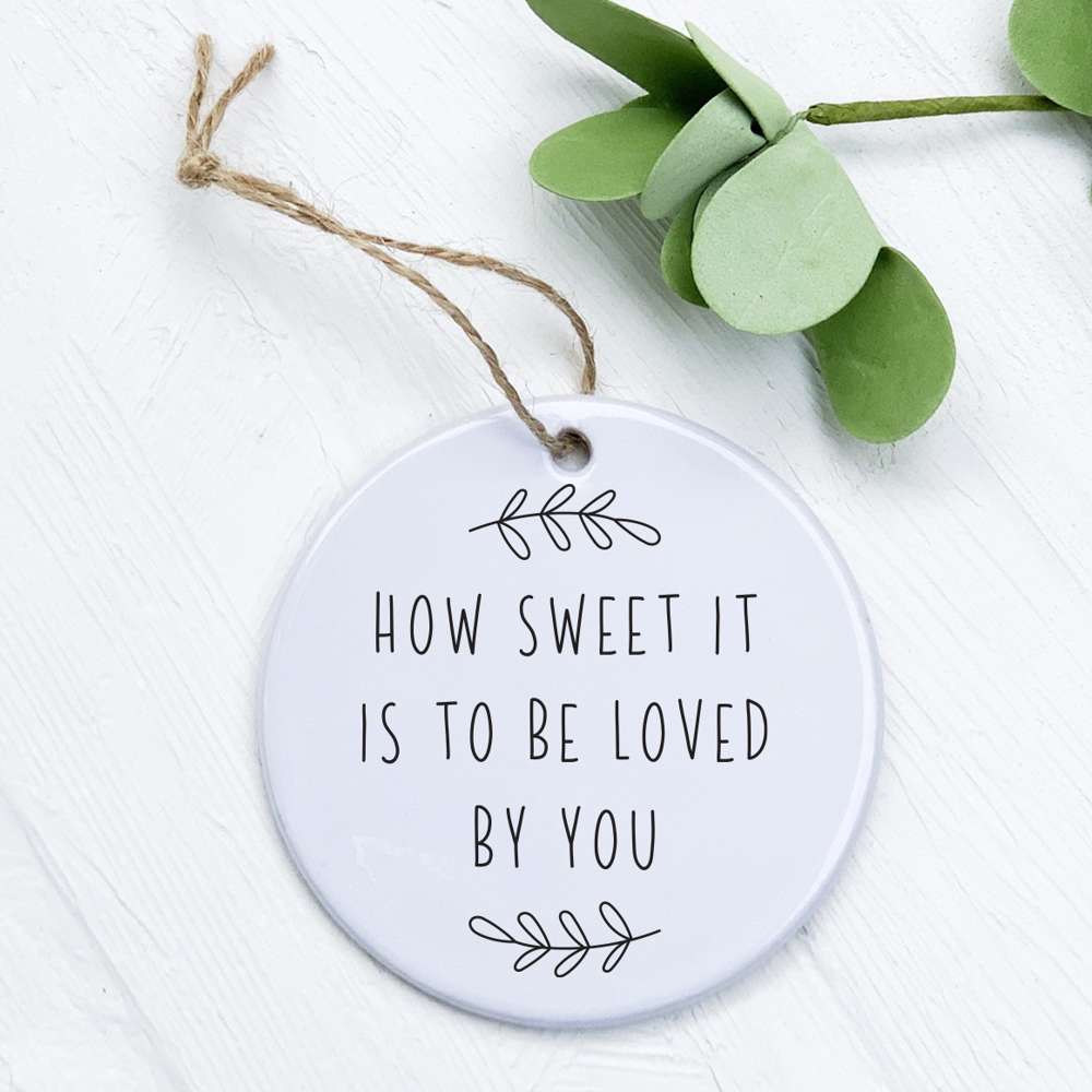 A beautifully designed porcelain ornament featuring original artwork, perfect for gifting or home decor.