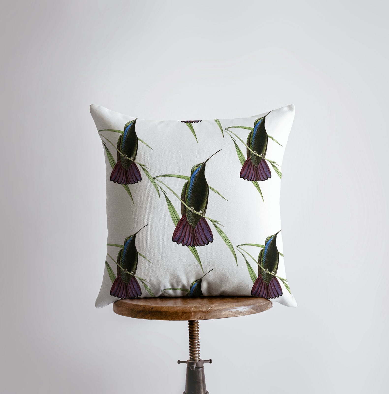 A beautifully designed Humming Bird Pillow Cover featuring a vibrant repeat pattern of hummingbirds, perfect for bird lovers and home decor.