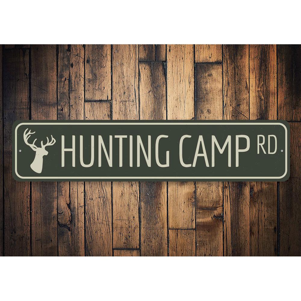 A decorative Hunting Camp Road Sign made of high-quality aluminum, featuring customizable text and pre-drilled holes for easy mounting.