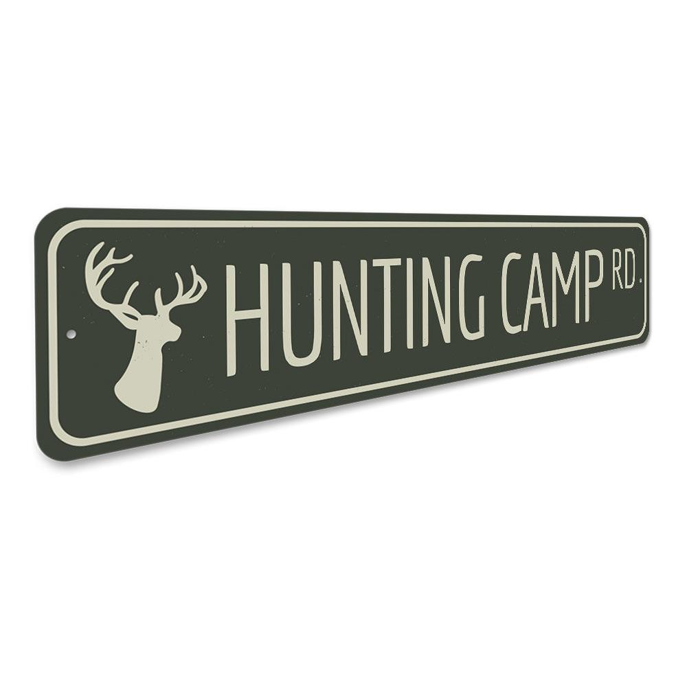 A decorative Hunting Camp Road Sign made of high-quality aluminum, featuring customizable text and pre-drilled holes for easy mounting.