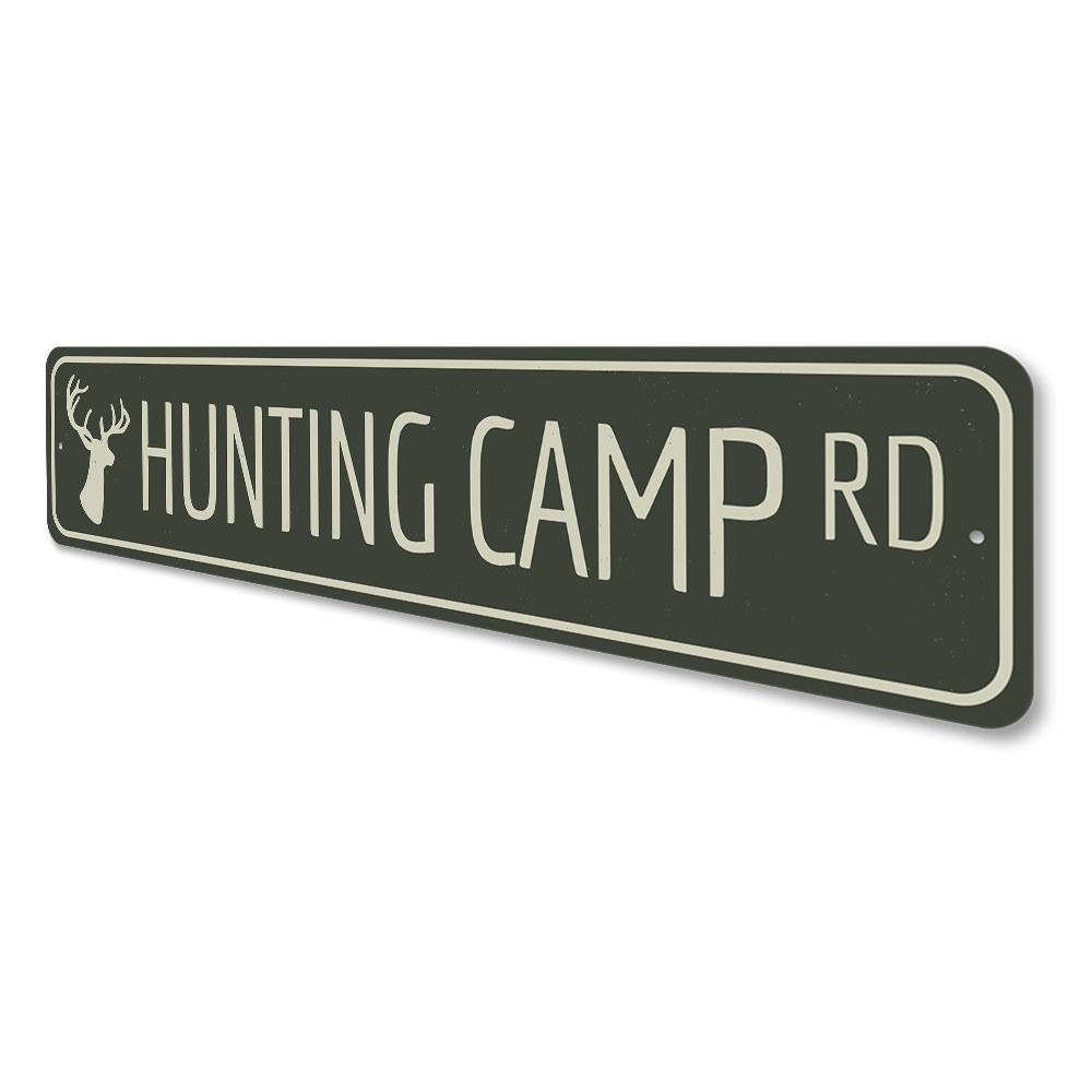 A decorative Hunting Camp Road Sign made of high-quality aluminum, featuring customizable text and pre-drilled holes for easy mounting.