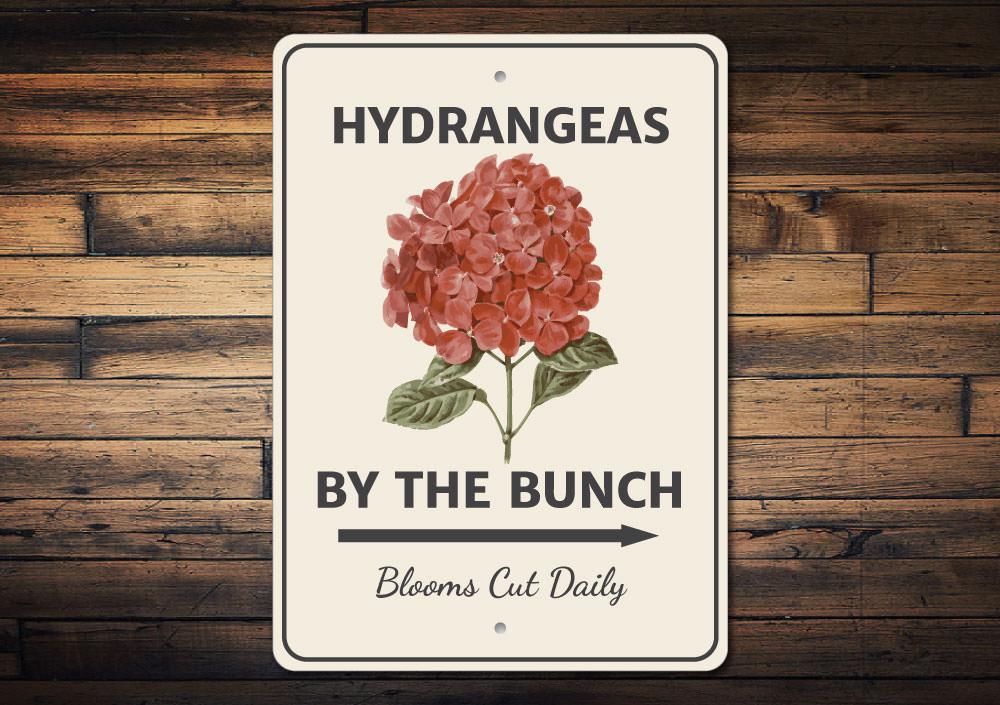 A decorative Hydrangeas by the Bunch Sign made of high-quality aluminum, featuring vibrant floral designs, perfect for home decor.