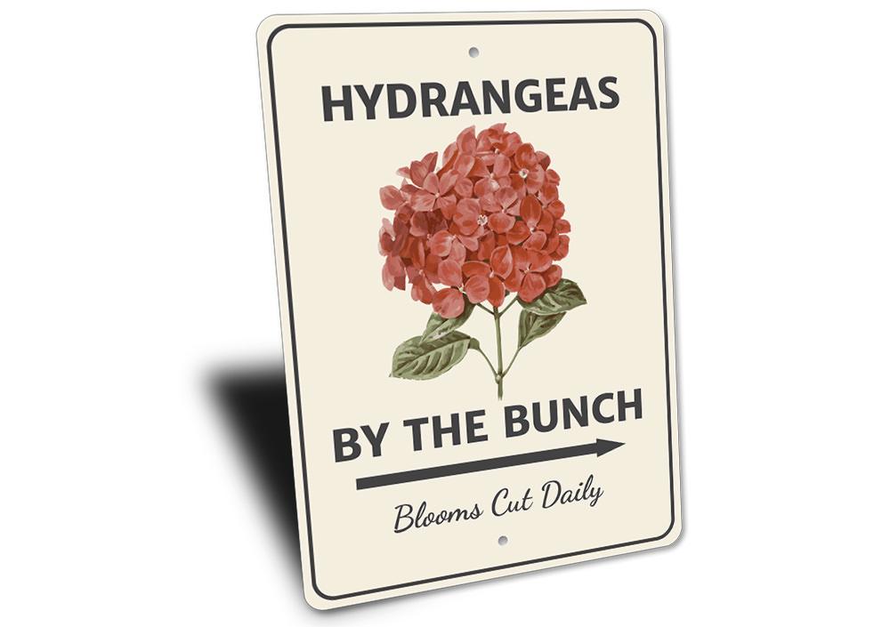 A decorative Hydrangeas by the Bunch Sign made of high-quality aluminum, featuring vibrant floral designs, perfect for home decor.