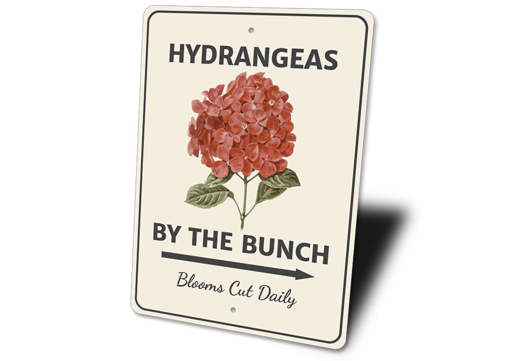 A decorative Hydrangeas by the Bunch Sign made of high-quality aluminum, featuring vibrant floral designs, perfect for home decor.