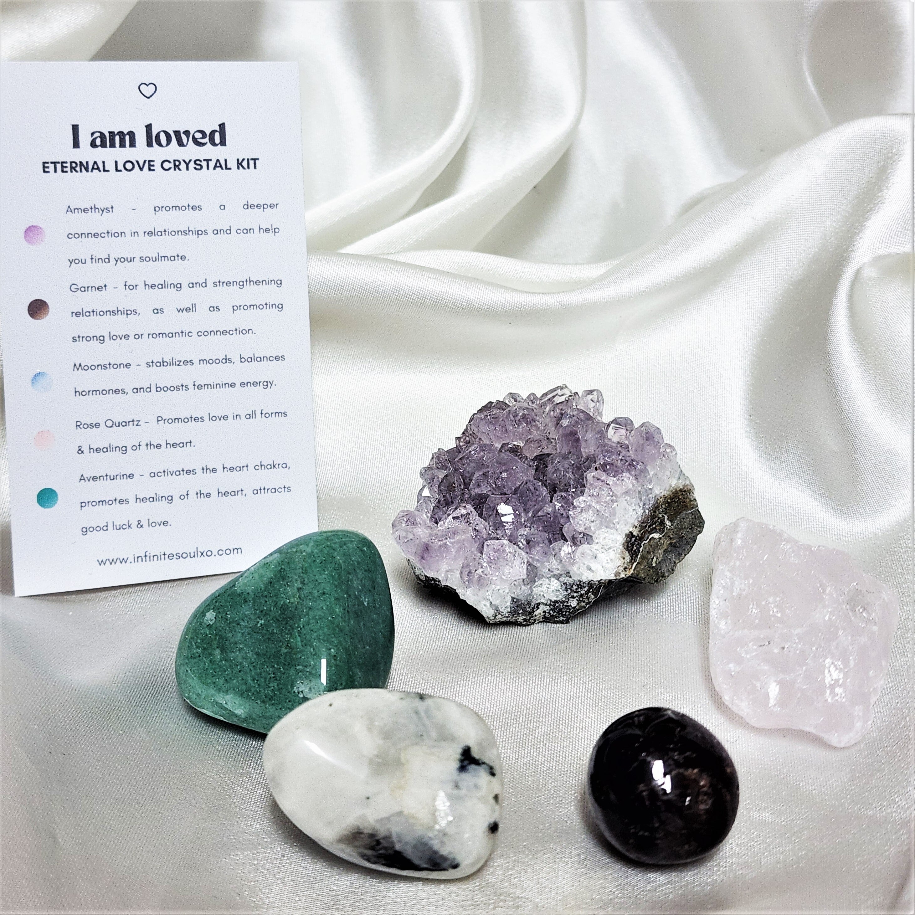 I am Loved - Eternal Love Crystal Kit featuring Rose Quartz, Green Aventurine, Rainbow Moonstone, Amethyst, and Garnet in a decorative arrangement.