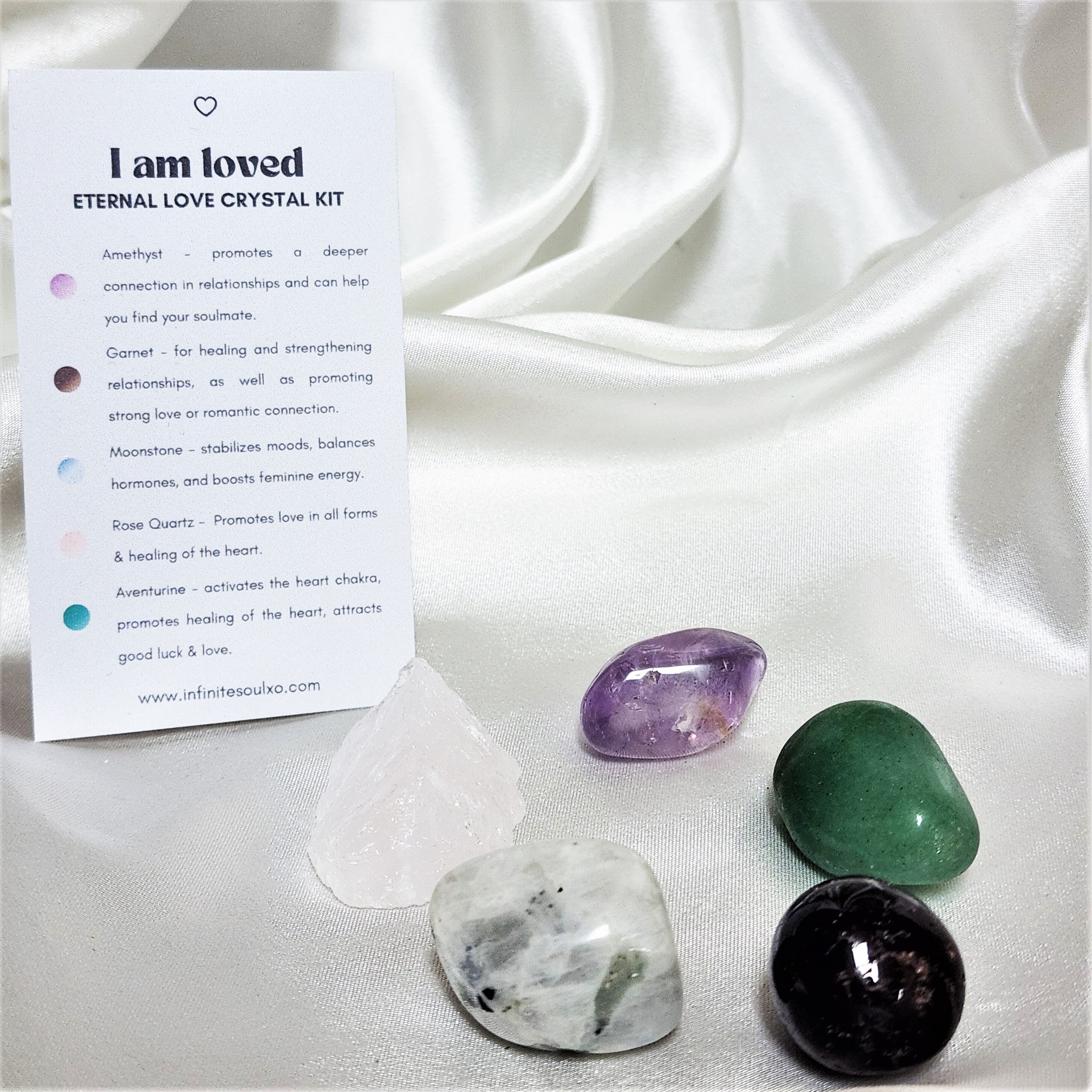 I am Loved - Eternal Love Crystal Kit featuring Rose Quartz, Green Aventurine, Rainbow Moonstone, Amethyst, and Garnet in a decorative arrangement.