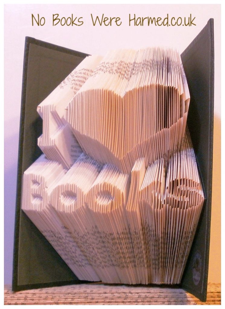 Handcrafted I ♥ Books art piece made from vintage book pages, showcasing intricate folds and unique design.