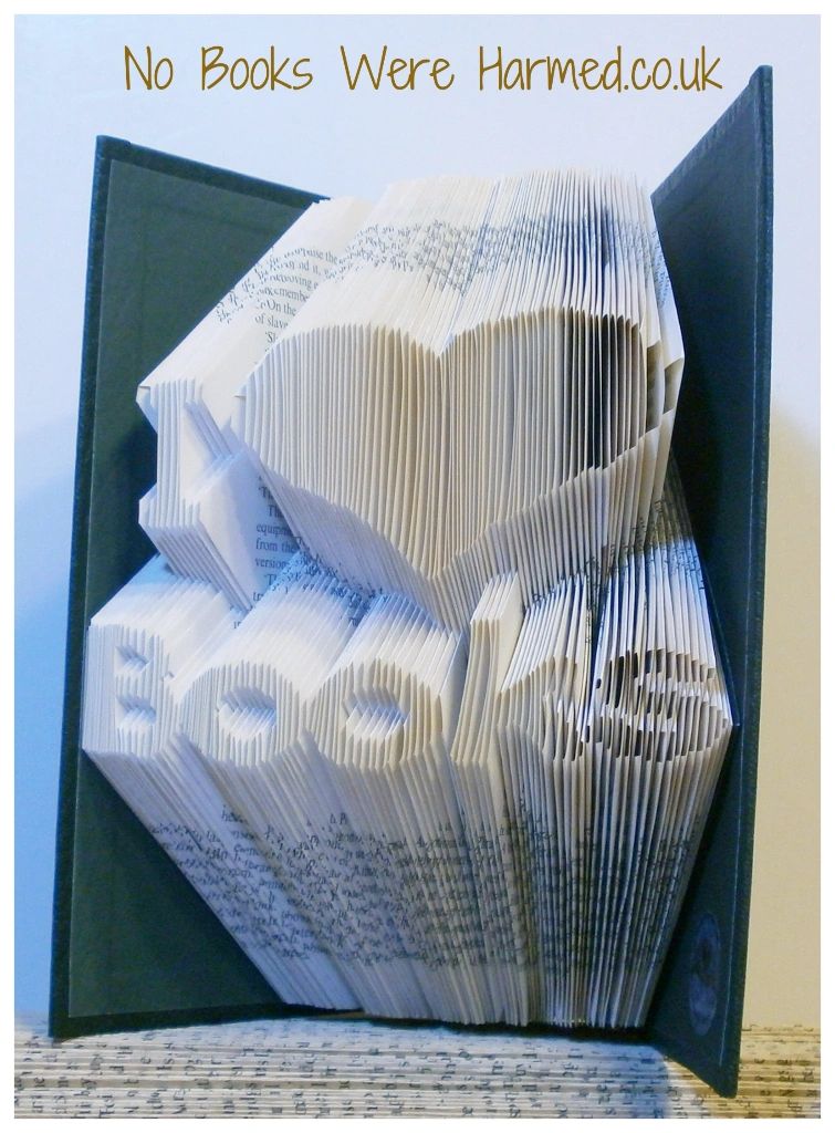 Handcrafted I ♥ Books art piece made from vintage book pages, showcasing intricate folds and unique design.