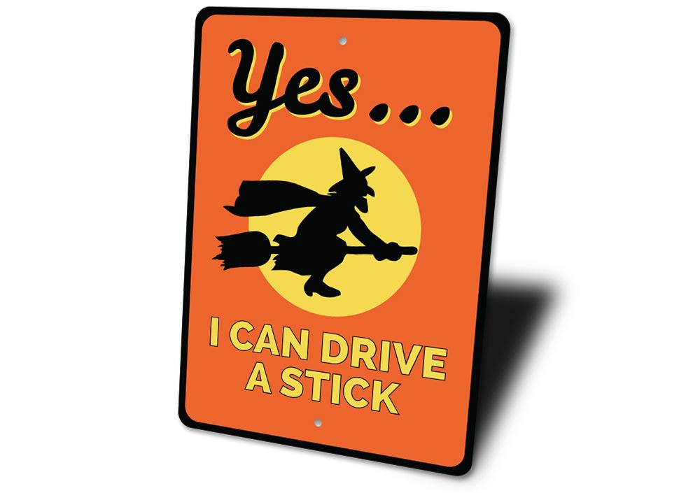 I Can Drive A Stick Sign made of high-quality aluminum, featuring spooky Halloween-themed design, perfect for indoor or outdoor decoration.