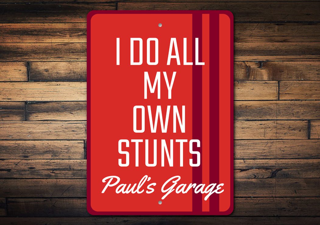 A humorous 'I Do All My Own Stunts' decorative metal sign, showcasing a playful design suitable for various indoor and outdoor settings.