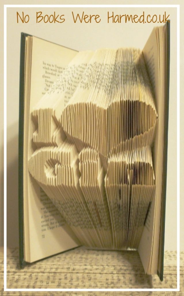 Handcrafted 'I ♥ Gin' book art made from vintage books, showcasing intricate page folds and unique design.